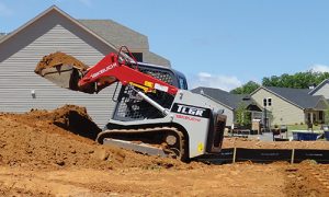 Side vide of TL6R bucket picking up dirt