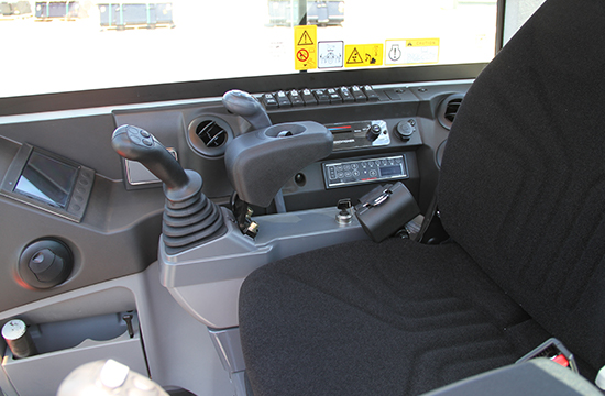 Part of cabin in TB250-2 showing joystick, display and functional switches