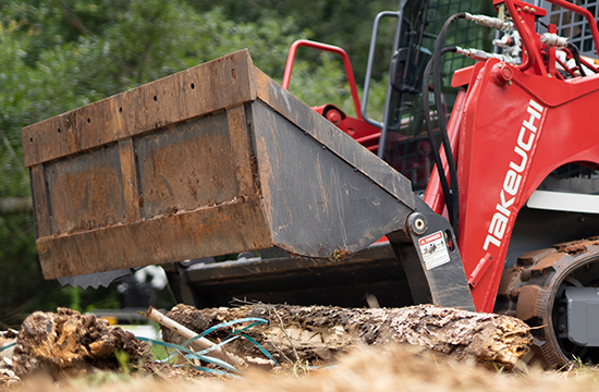 Close up photo of attachment on a track loader